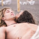 lover couple of caucasian male and female lay down at the beach relaxing