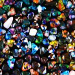 blue green and red heart shaped stone