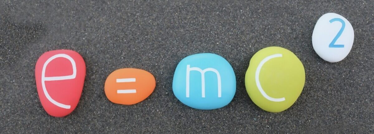 Science physics formula e=mc2, Theory of relativity composed with colored and carved stones